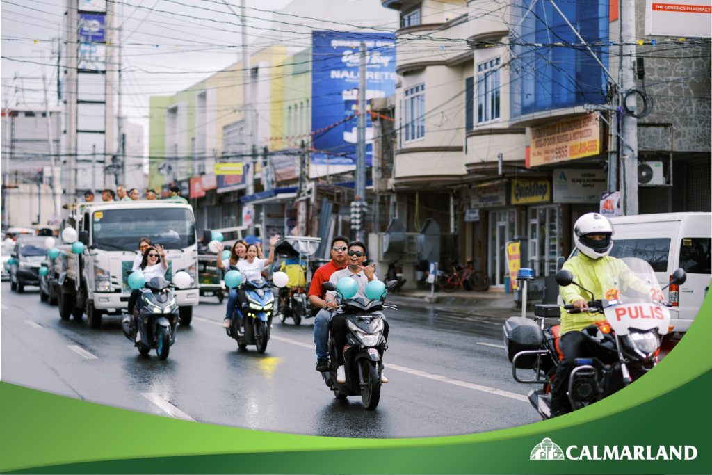 Community motorcade celebrating East Grove 2 in Lucena City, showcasing vibrant participation and unity.